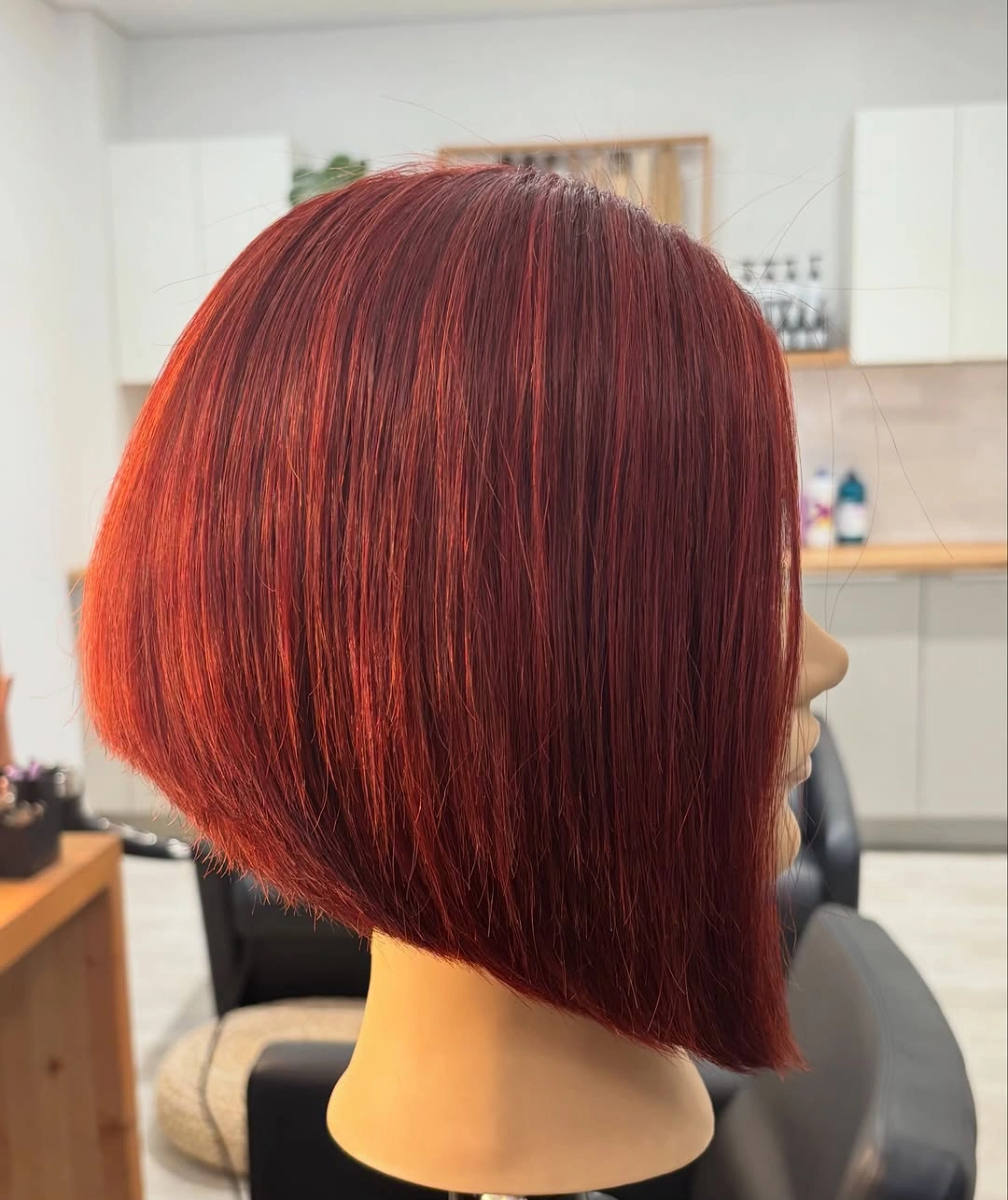 Short red A-line bob with rounded back and longer front edge