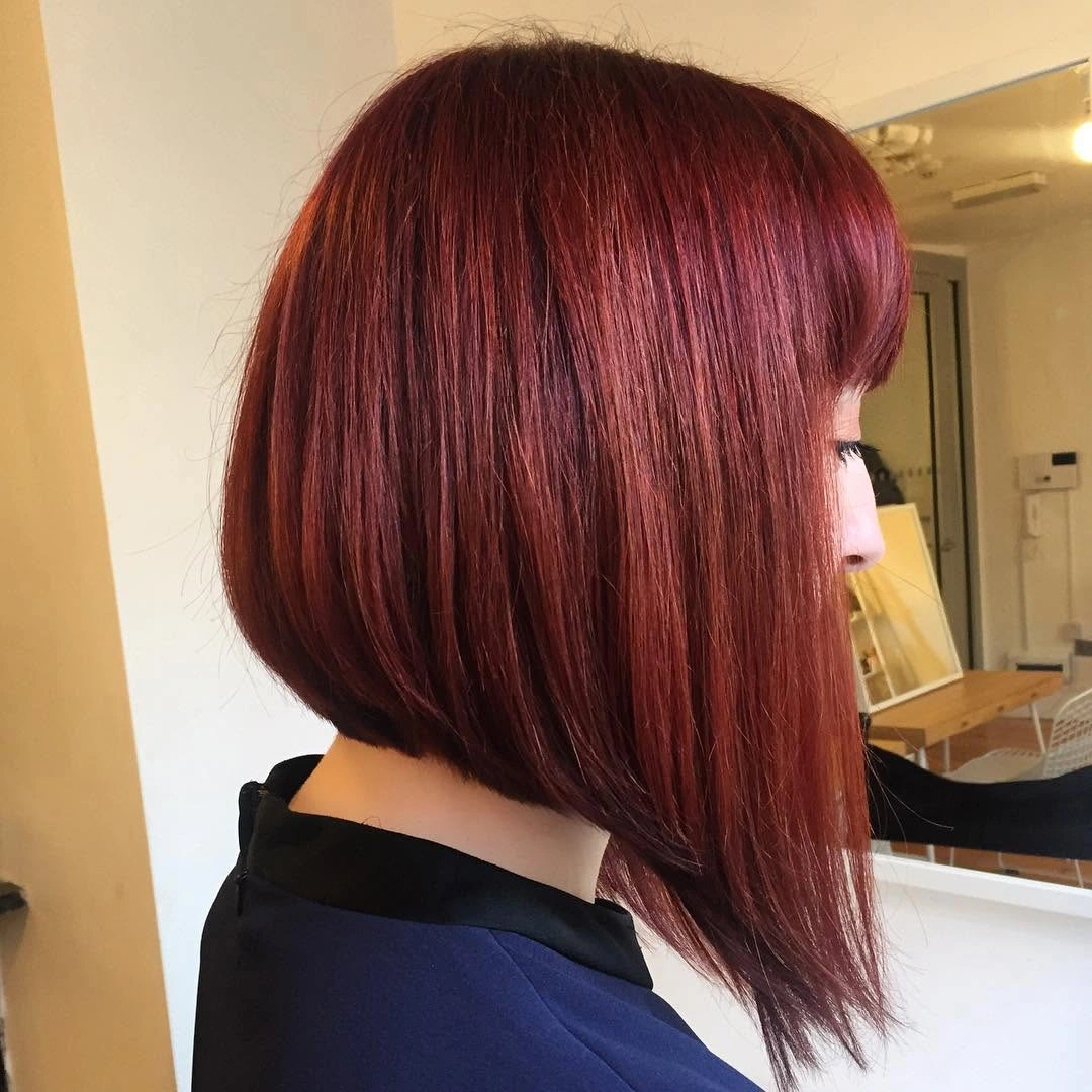 Smooth red angled bob with rounded back and long front panel