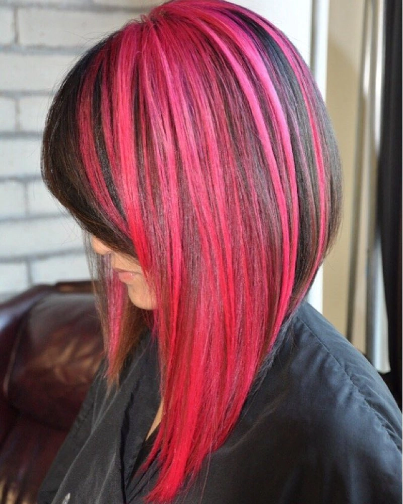 Dark angled bob with vivid pink panels and long front pieces