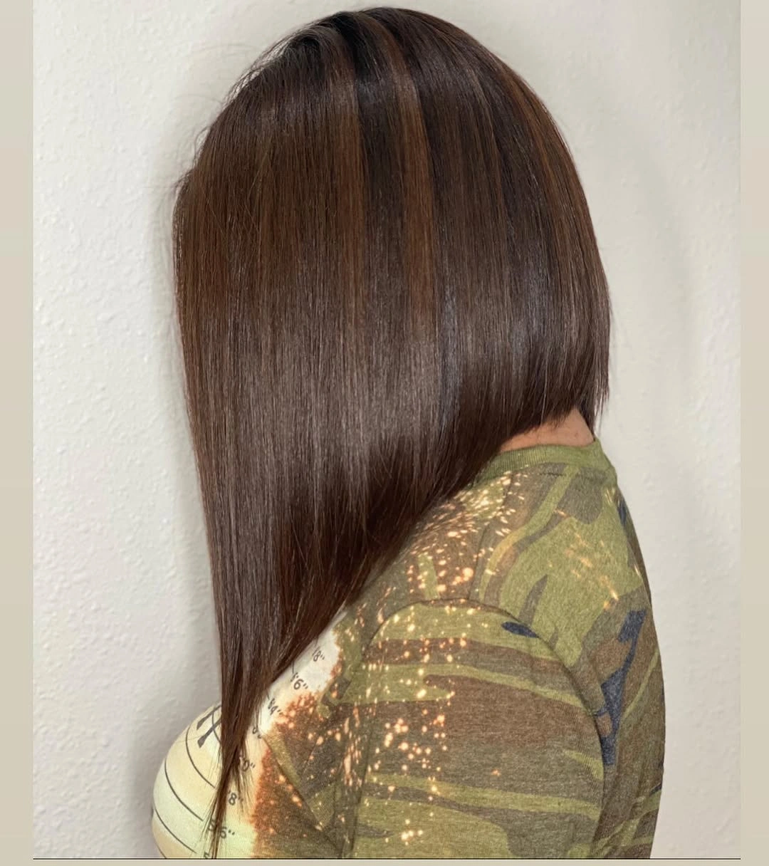 Sleek brunette long A-line bob with rounded crown and front point