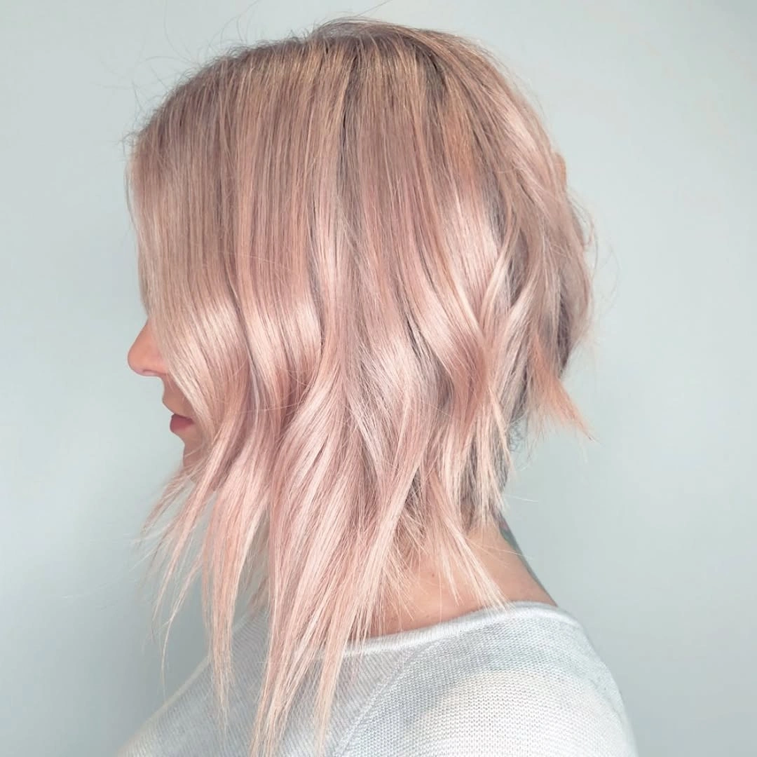 Pale pink wavy bob with piecey ends and longer front strands