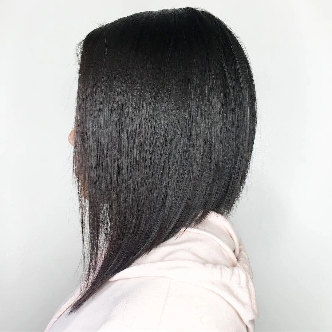 Sleek black long A-line bob with smooth crown and narrow front point