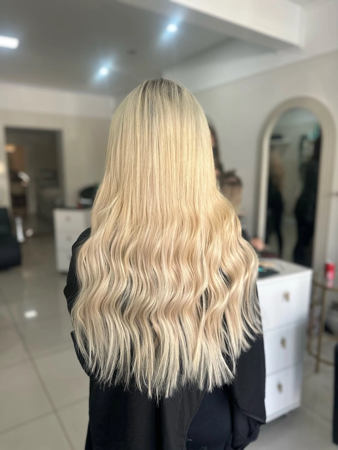 Long pale blonde hair with smooth crown and waves