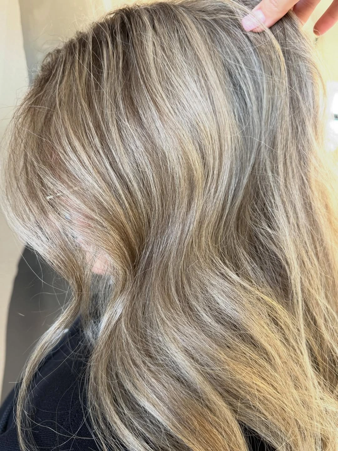 Close detail of ash beige blonde with pale ribbons