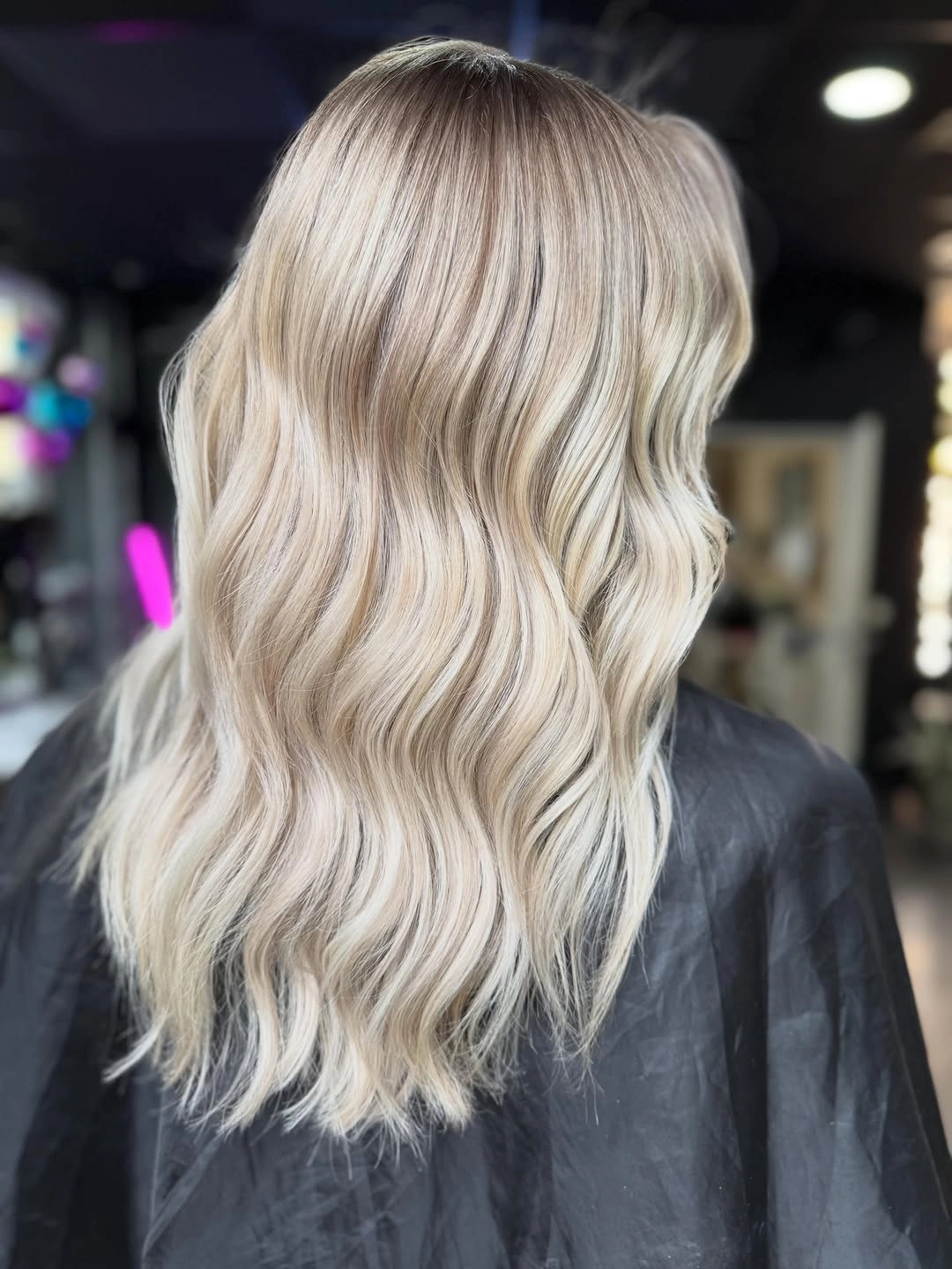 Back view of pale beige blonde waves with airy ends