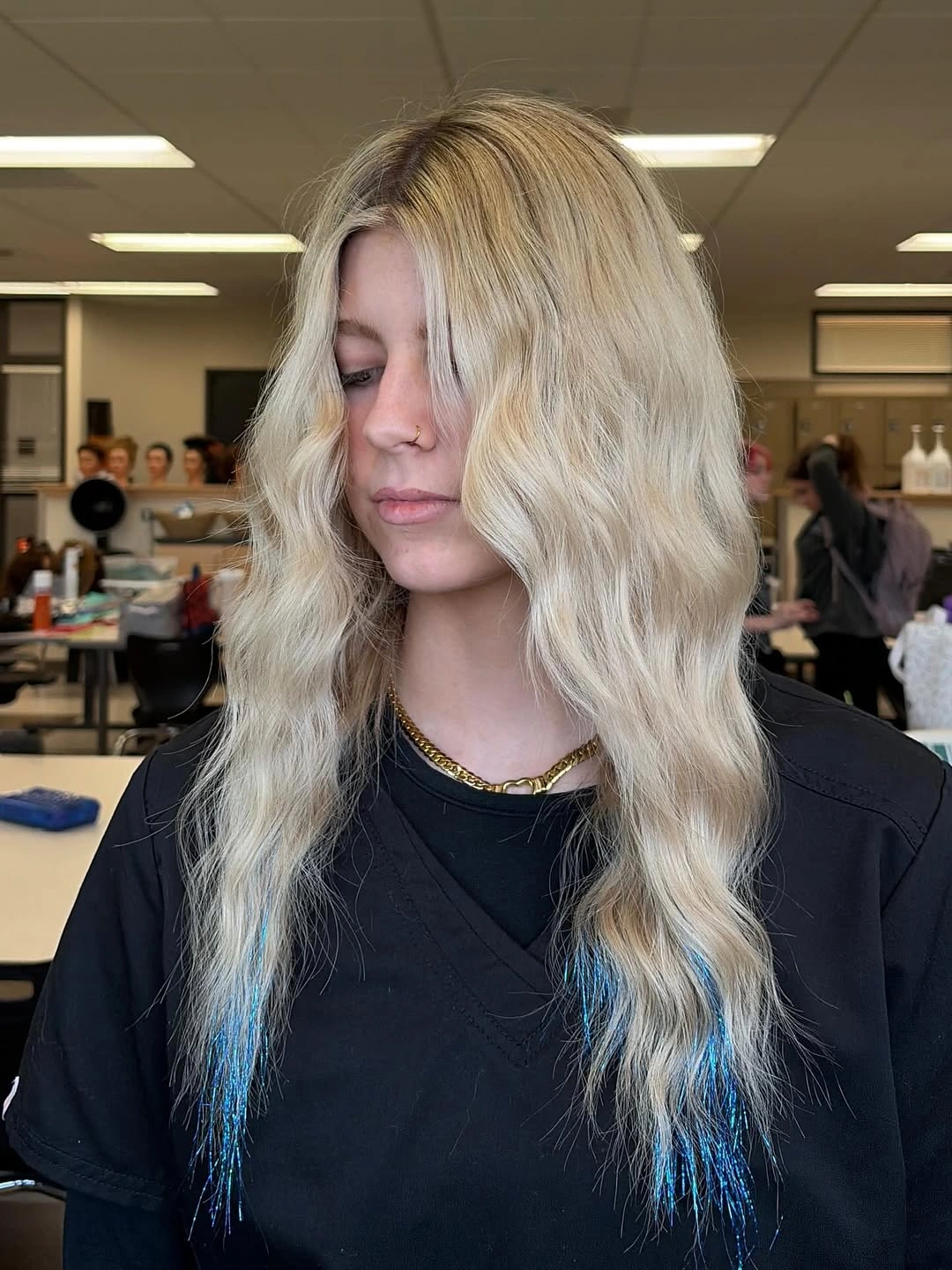Wavy blonde hair with blue toned lower pieces