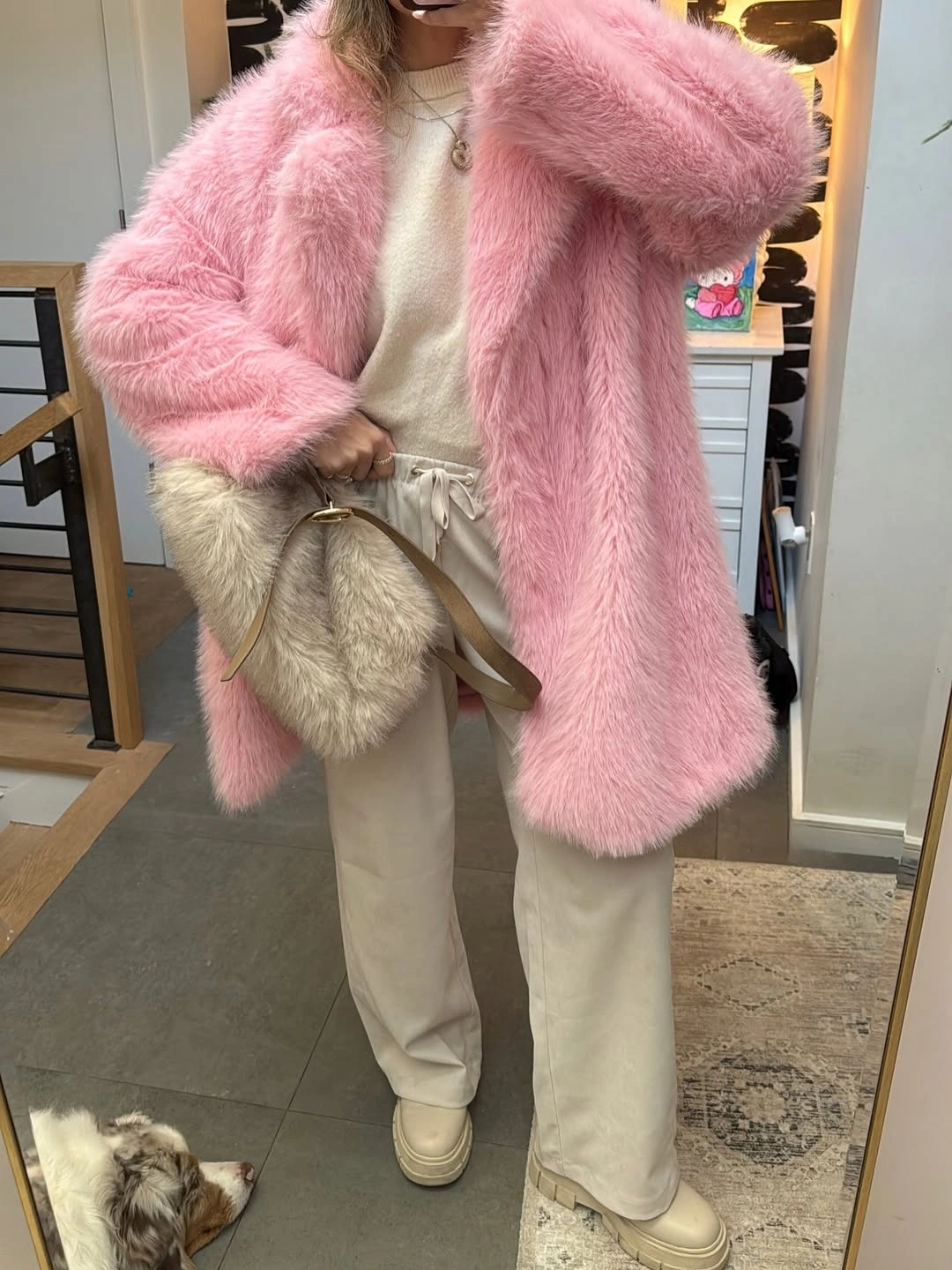 Oversized pink textured coat with cream knit, wide trousers, and platform shoes