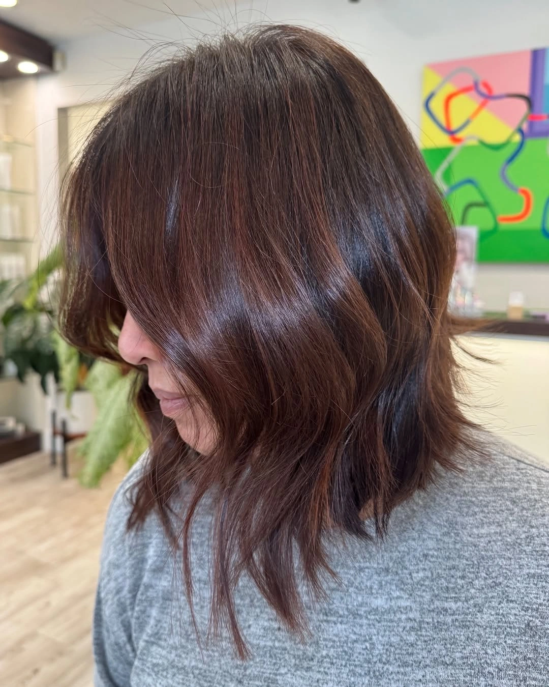 Shoulder-length layered hair with sweeping front and pointed ends