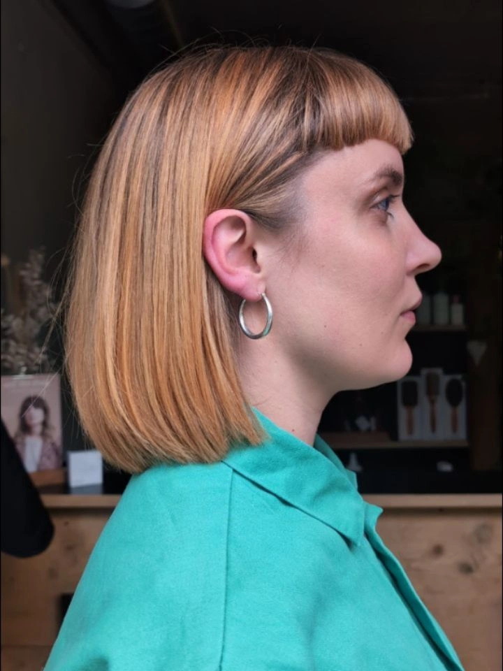 Straight short bob with blunt bangs and clean lower edge