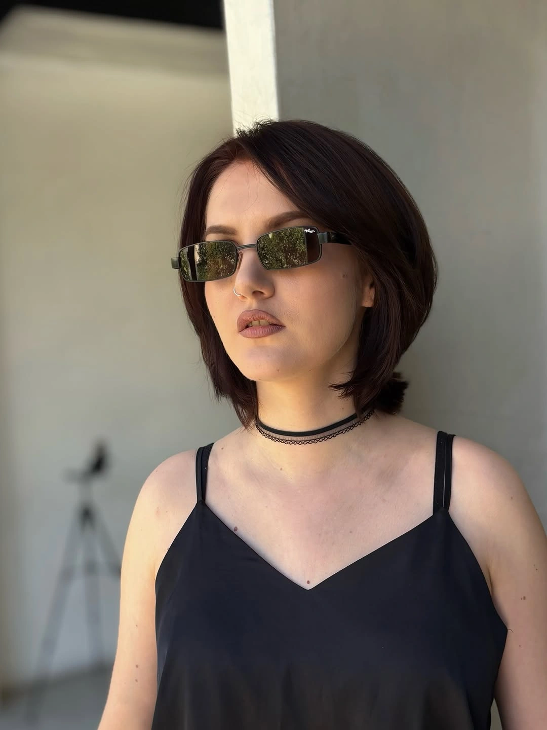 Short dark layered bob with center part and shorter back