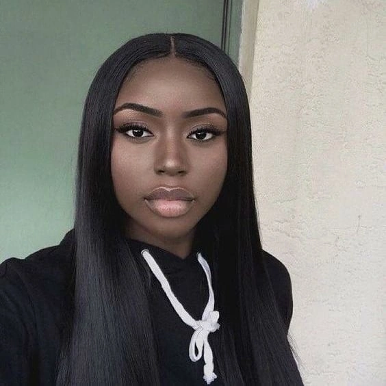 Long straight dark hair with a center part and smooth narrow side panels