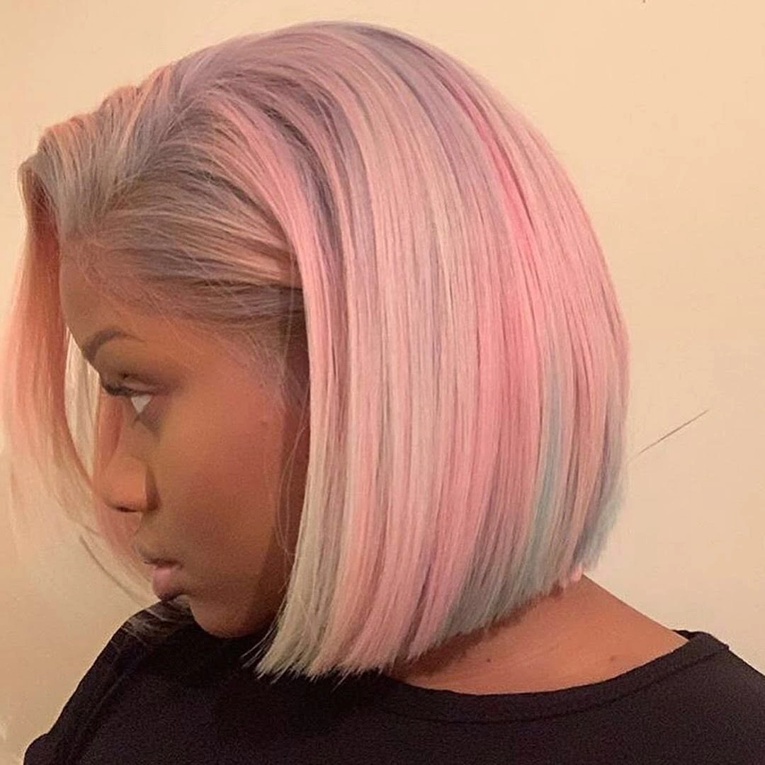 Pink bob with a swept front and pale gray-beige streaks near the ends