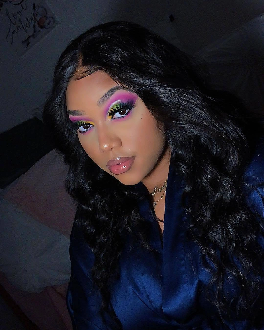 Long dark hair with broad S-shaped waves falling over both shoulders
