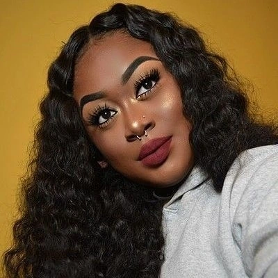 Long dark rippled hair with broad curved waves beside the part