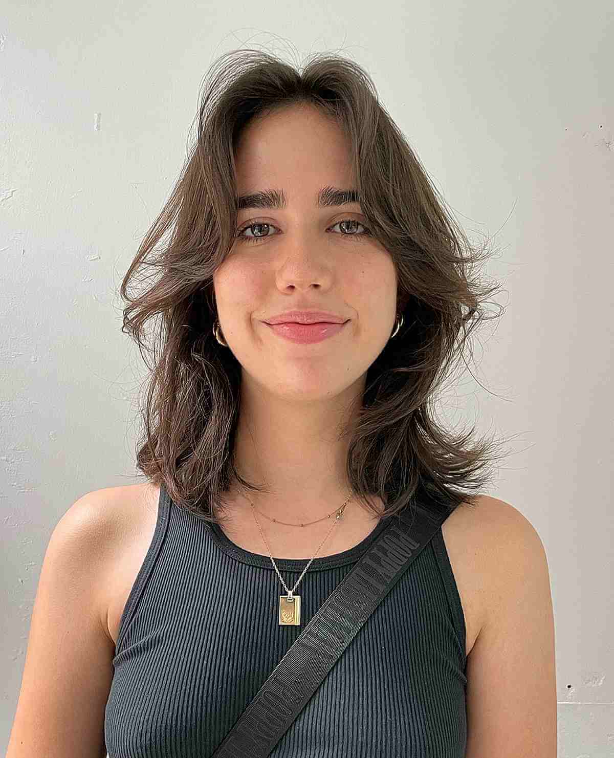 Collarbone Shag With Curtain Bangs Collarbone Shag With Curtain Bangs — Winter Haircuts for Oval Faces