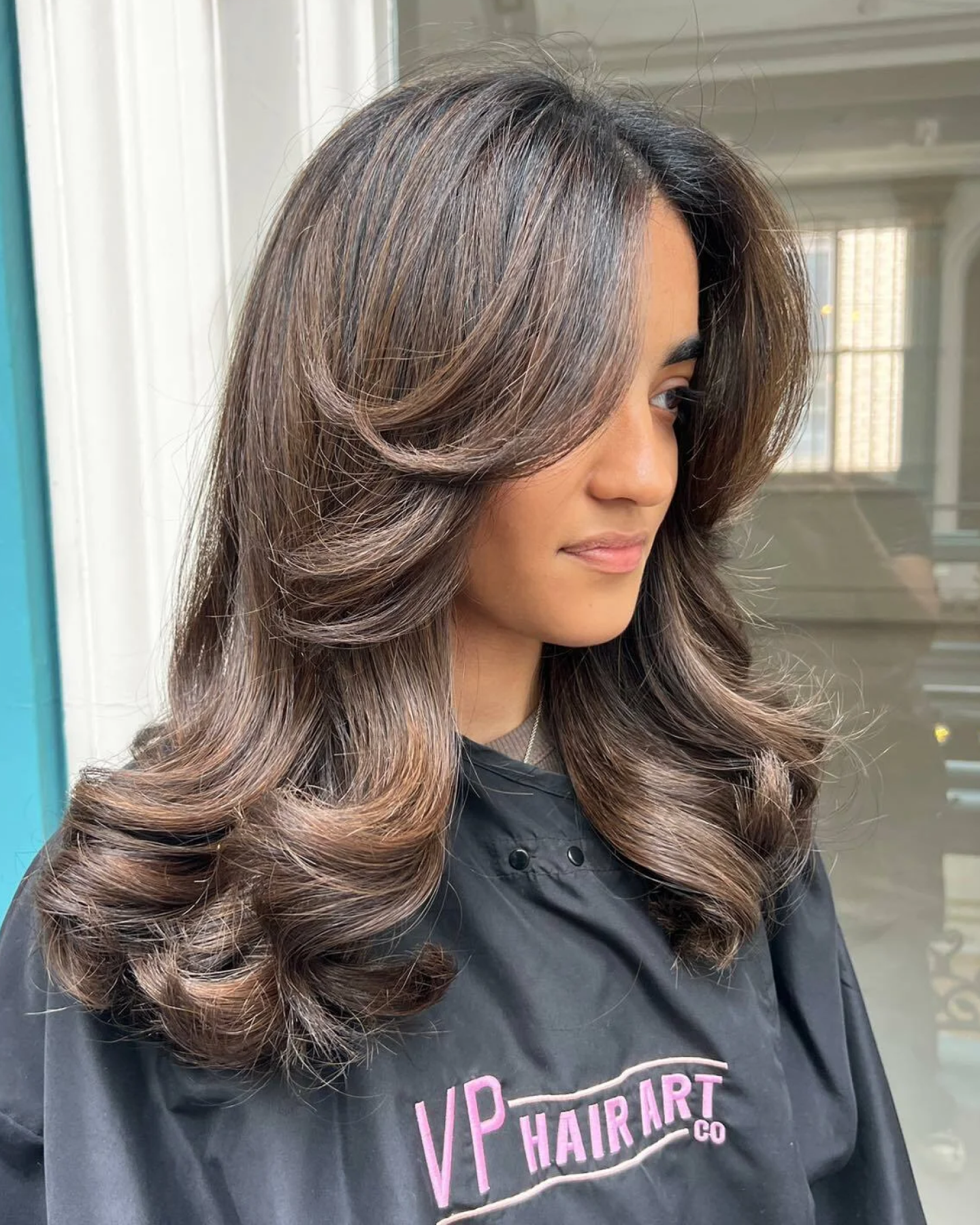 Long Voluminous Curls With Curtain Bangs — Winter Haircuts for Girls