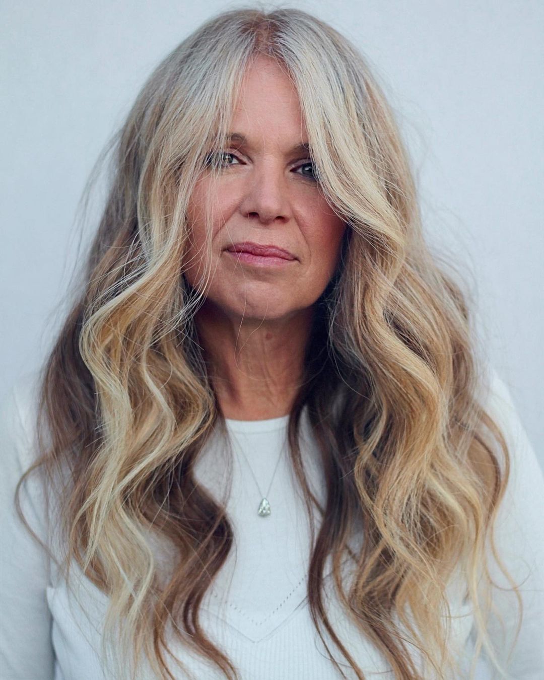 Collarbone Layers with Curtain Bangs — Winter Hairstyles for Women Over 50