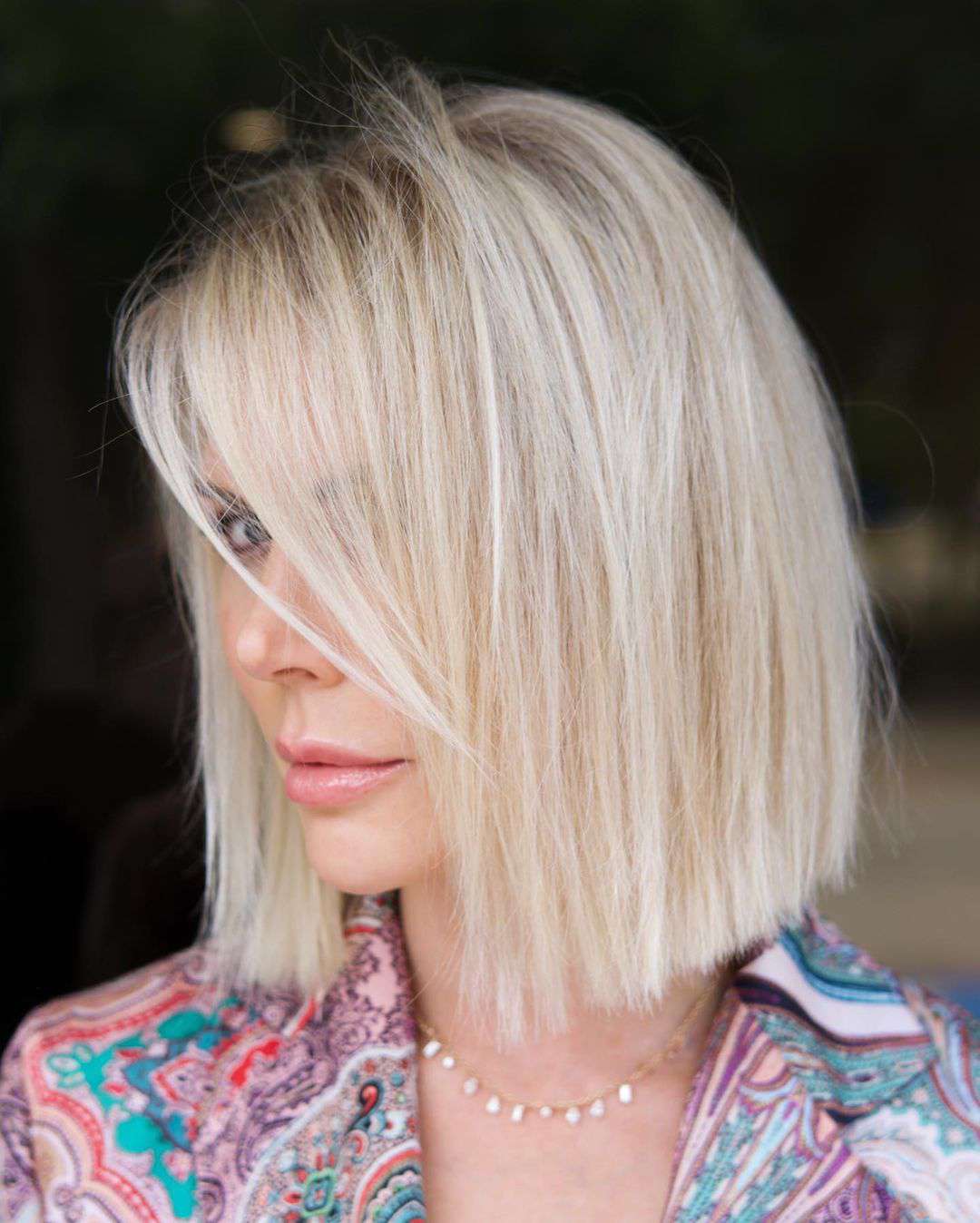 Chic Platinum Blunt Bob with Wispy Bangs — Winter Hairstyles for Women Over 50