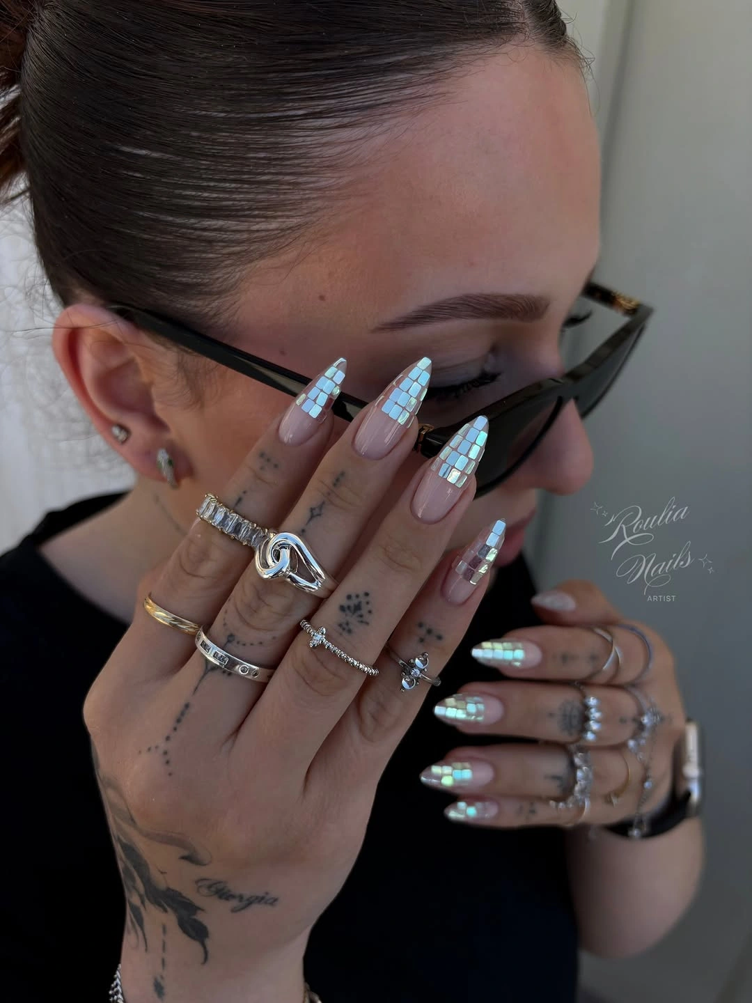 Long square nails with blue and white grid-patterned tips
