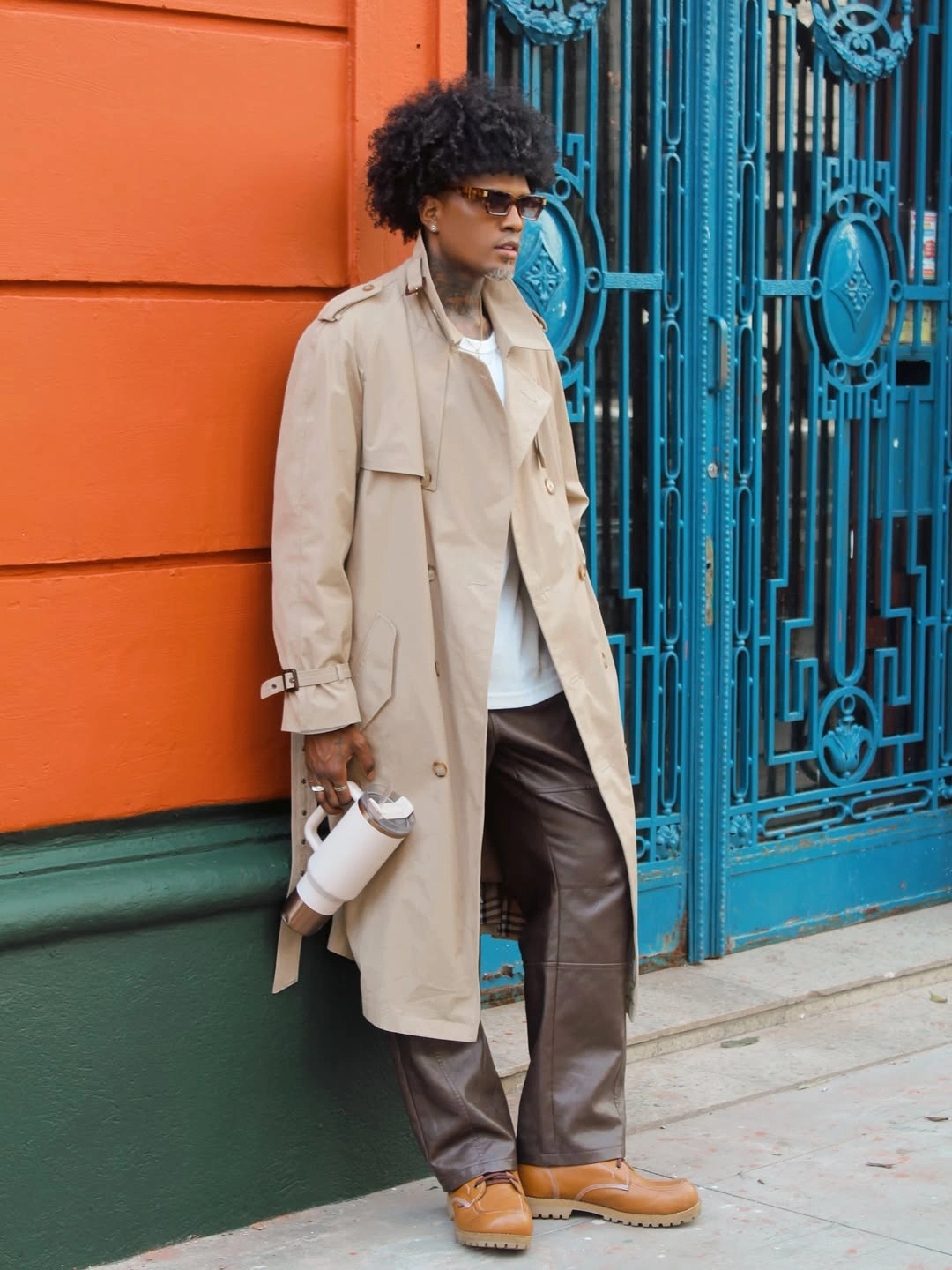 Light overshirt over brown trousers with tan lace-up boots