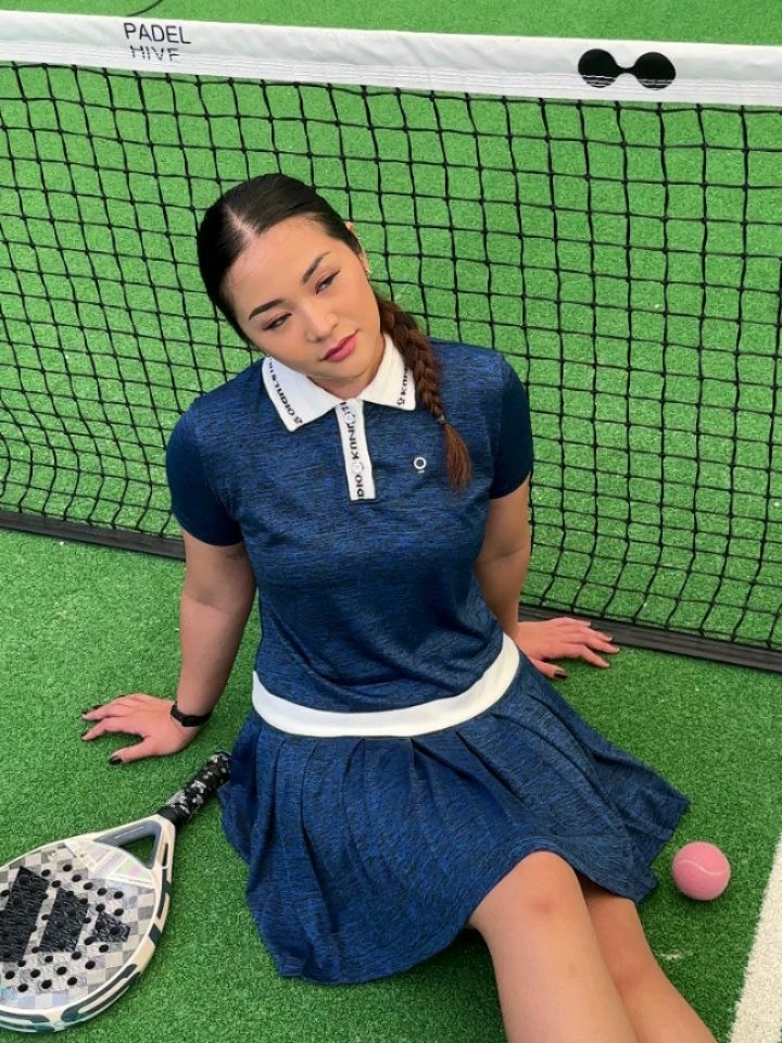 Blue polo dress with white trim for a women’s padel outfit