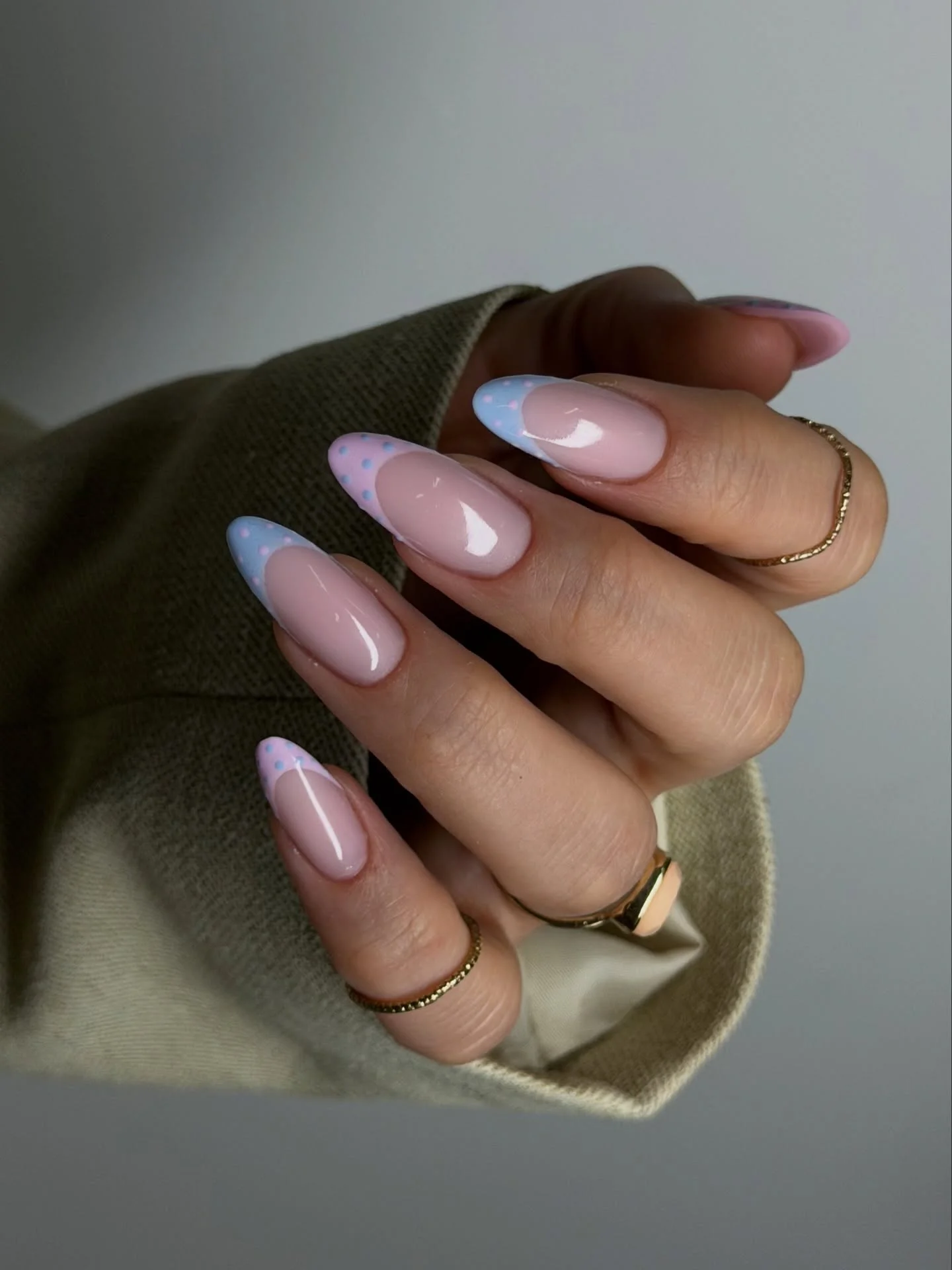 Long mauve almond nails with pale blue and black white dotted tip accents