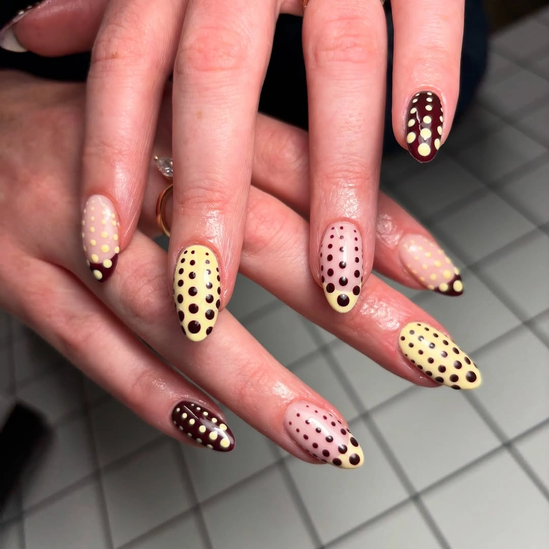 Long almond nails in cream burgundy and blush pink with dark polka dots