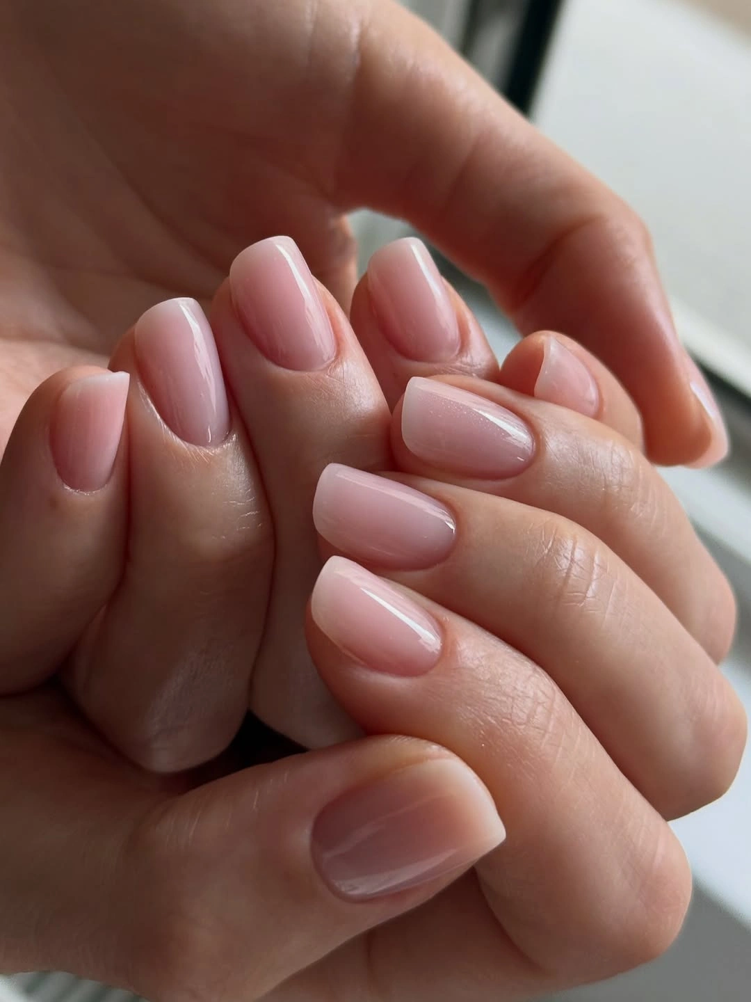 Short oval nails with sheer pale pink gloss