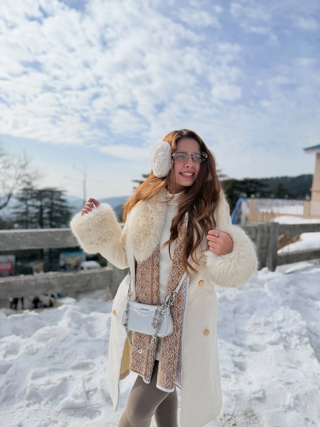 Cream coat and knit hat with patterned long scarf mittens and white crossbody