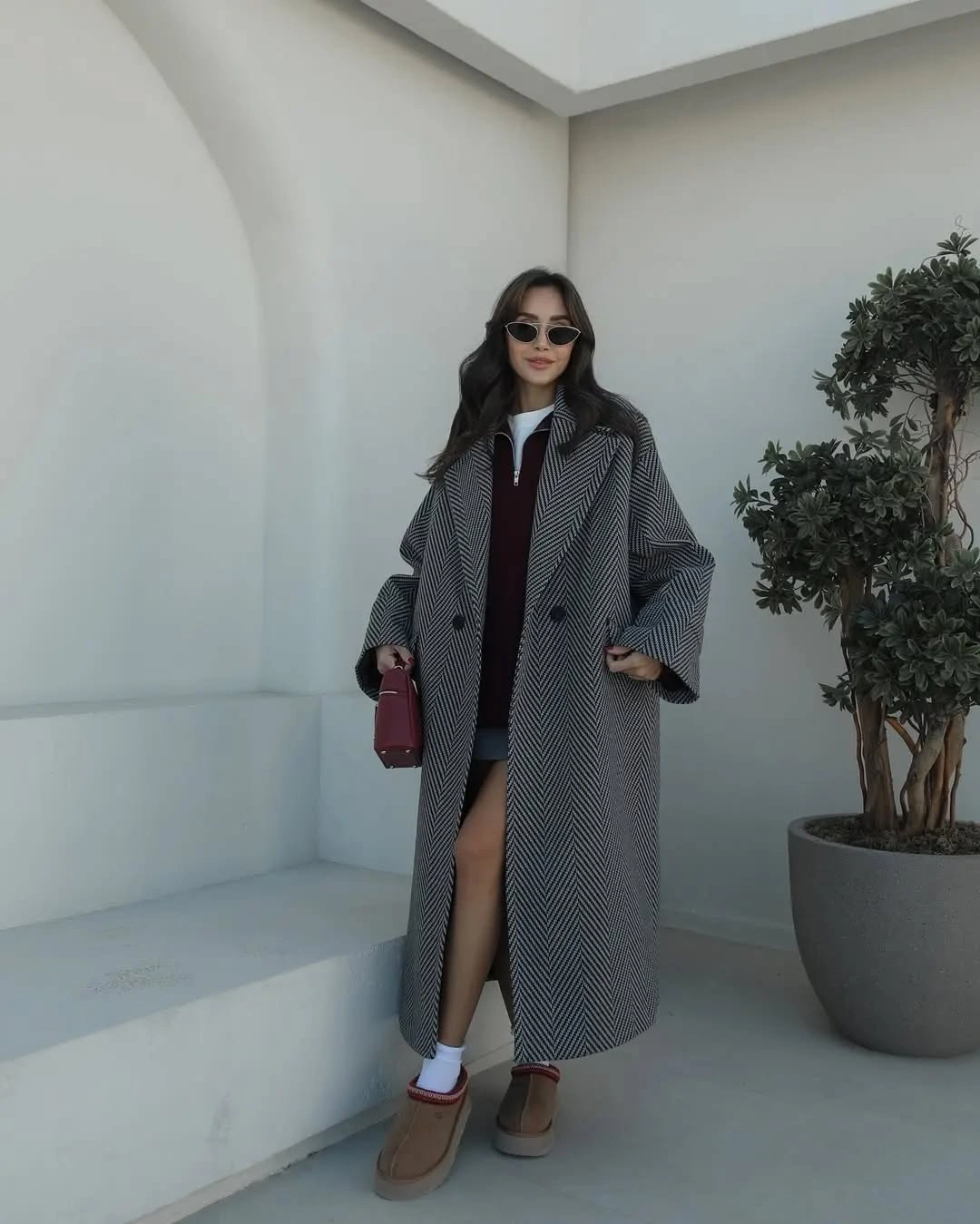 Gray chevron coat with burgundy sweater and tan boots