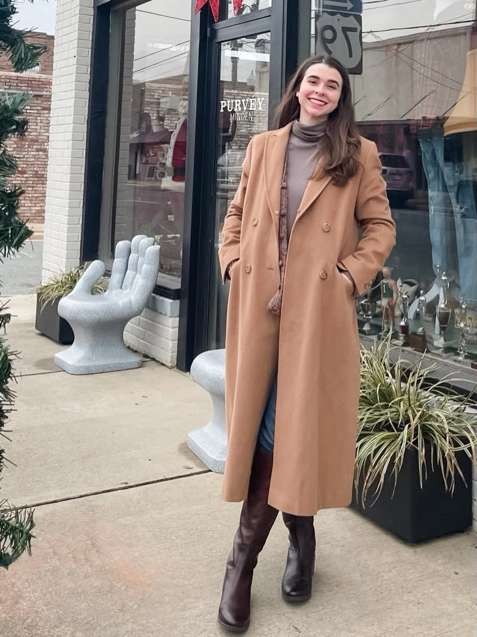 Camel double-breasted coat with jeans and brown tall boots