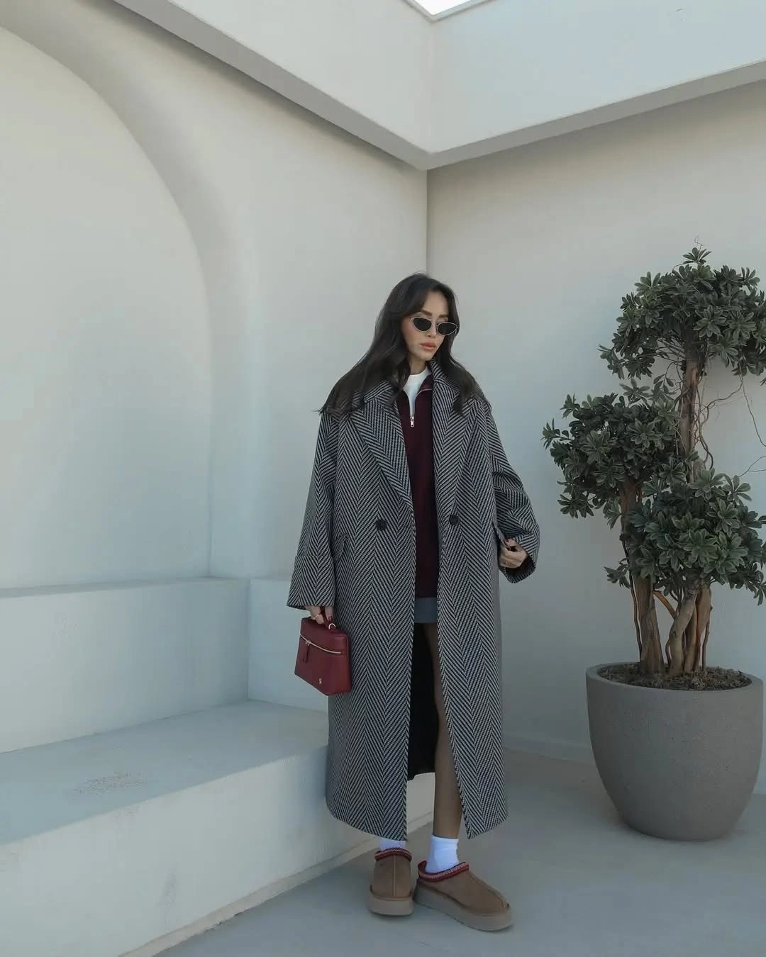Gray chevron coat with short layer and tan boots