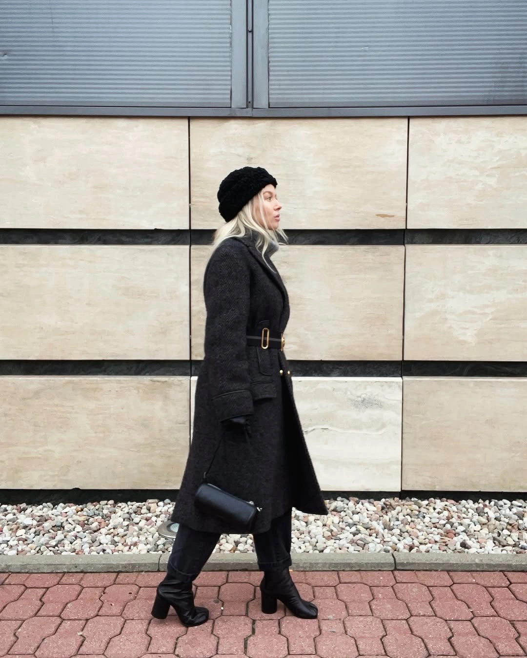 Black belted long coat with beret and heeled boots