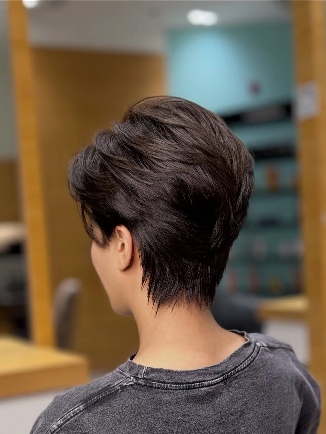 Rear view of short dark crop with tapered nape