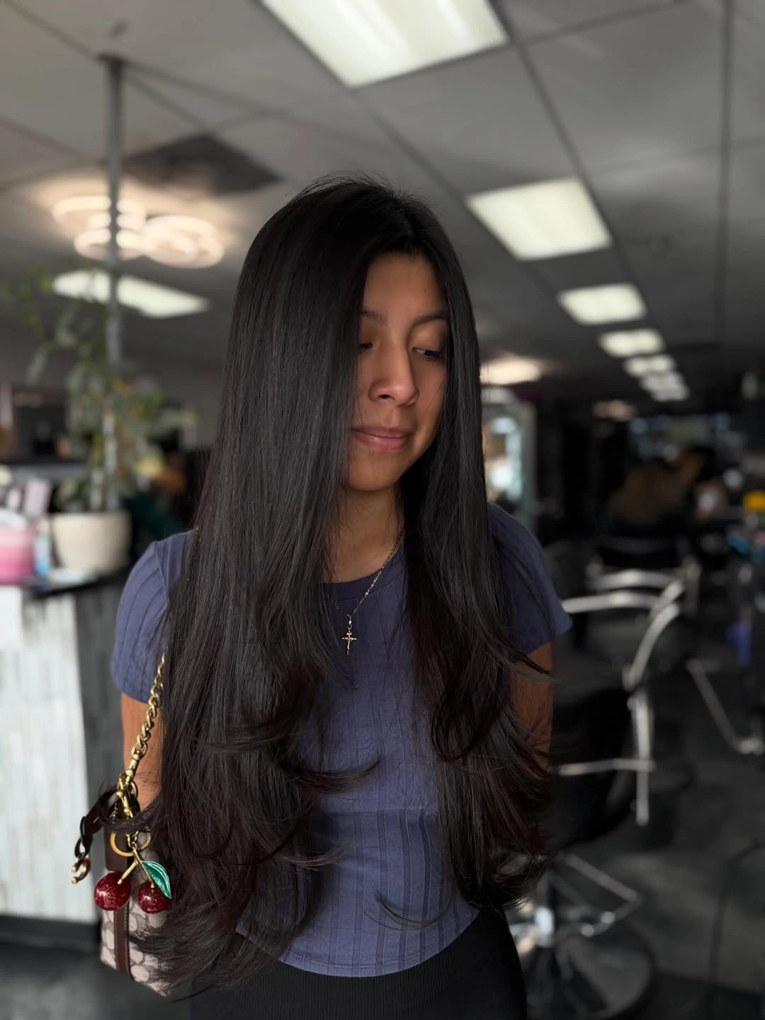 Very long straight dark hair with subtle face framing