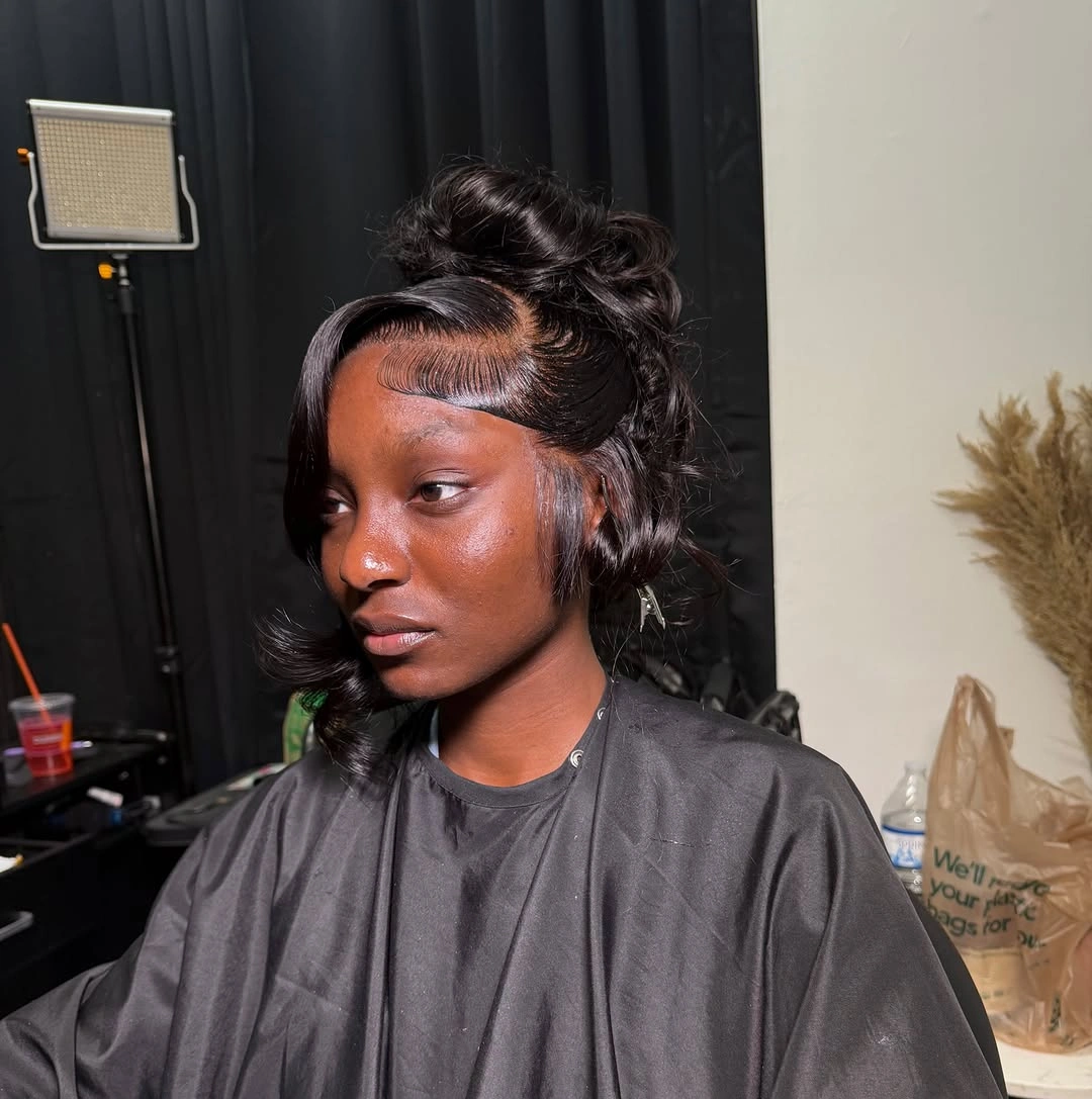 Medium curled half-up hair with side-swept front