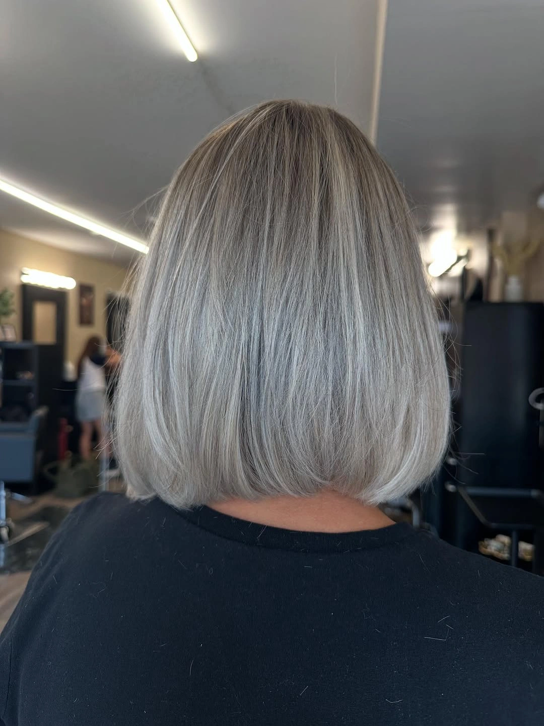 Longer straight brunette cut with face-framing front pieces