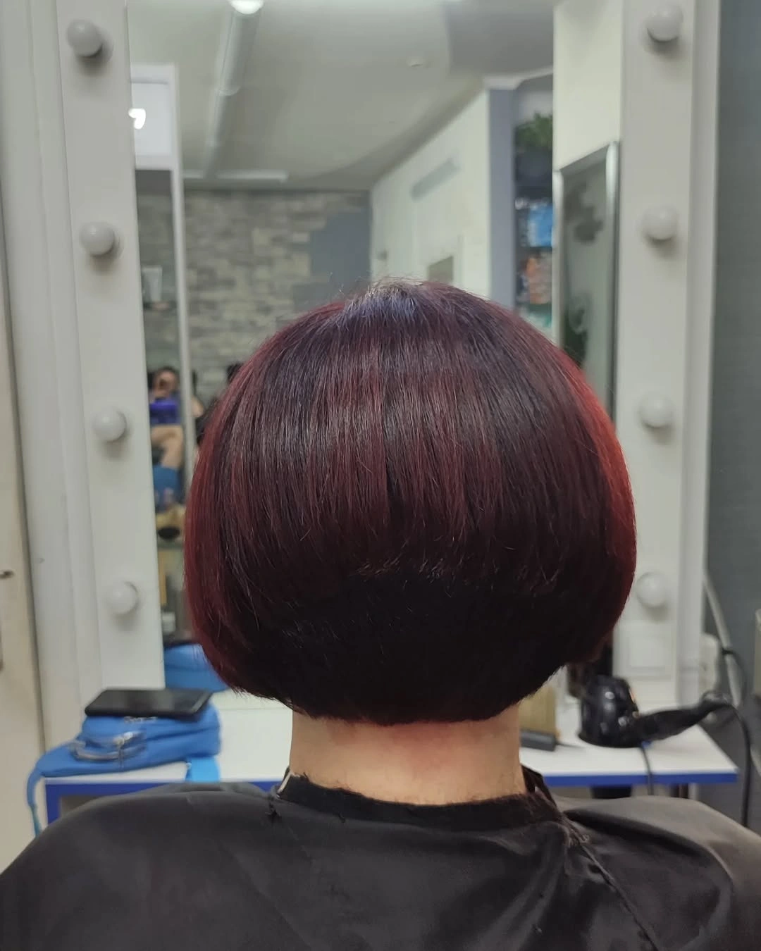 Medium warm brunette layered cut with swept front pieces