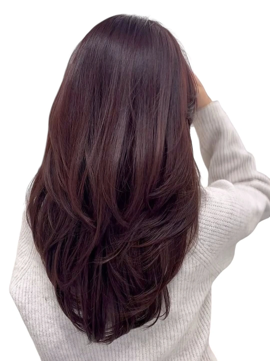 Dark brunette rounded bob with sweeping bangs and curved ends