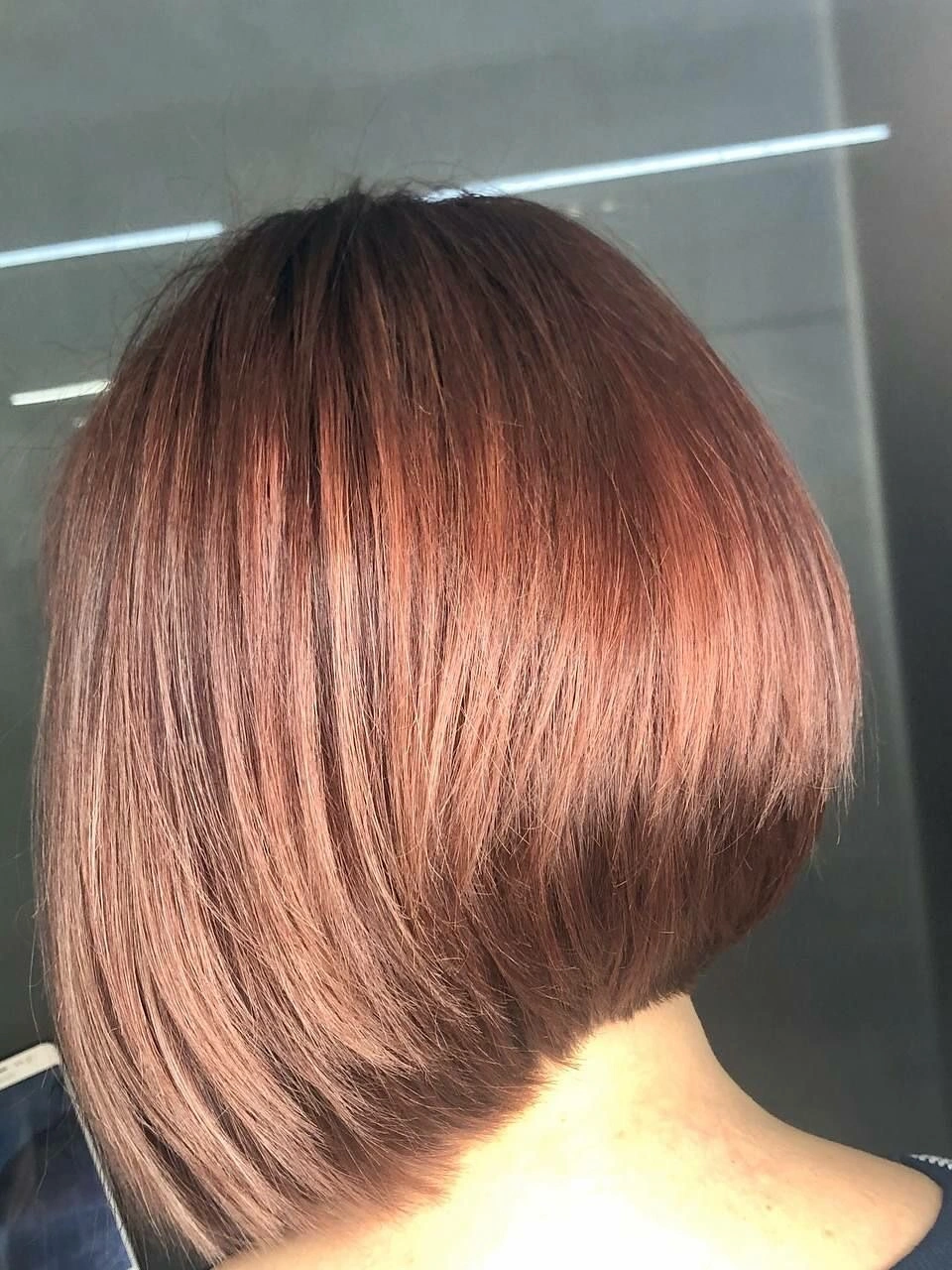 Silver-toned short crop with glasses and neat tapered nape