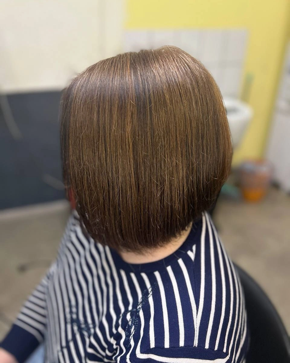 Dark brunette asymmetrical bob with smooth longer front piece