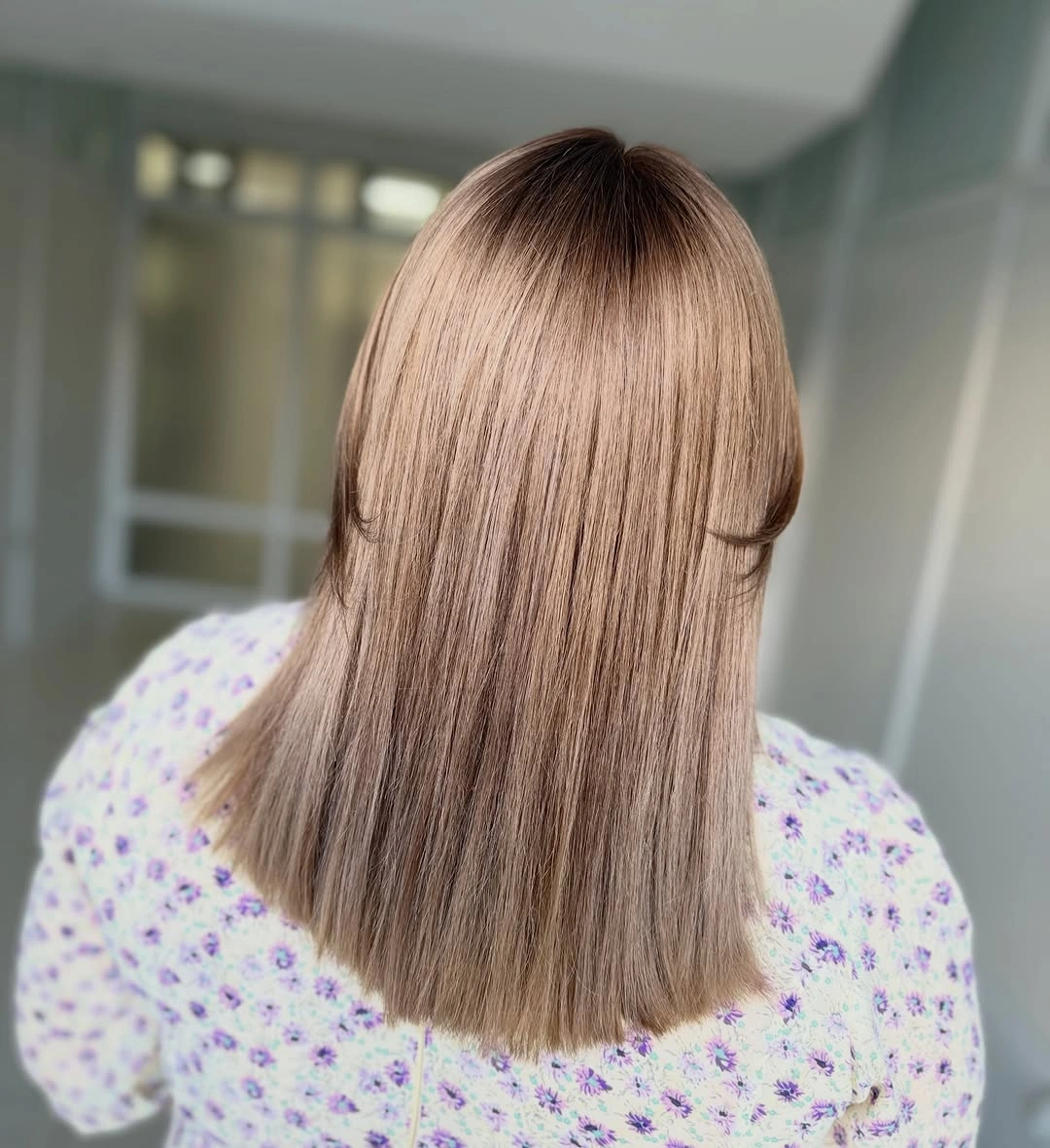 Back view of long straight light brown hair
