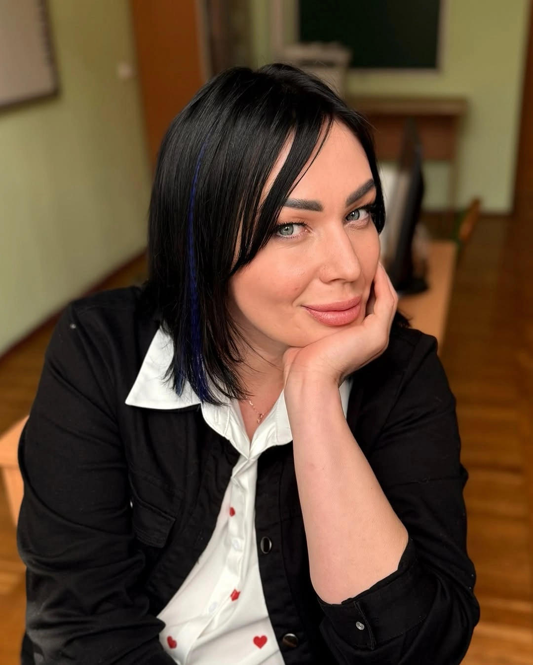 Front view of black bob with long side bangs