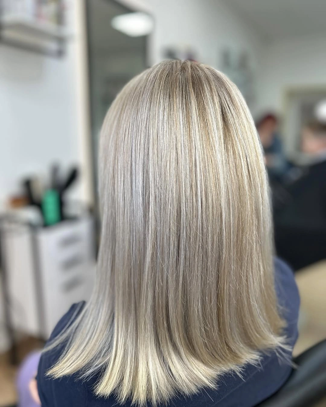 Back view of straight blonde shoulder length hair
