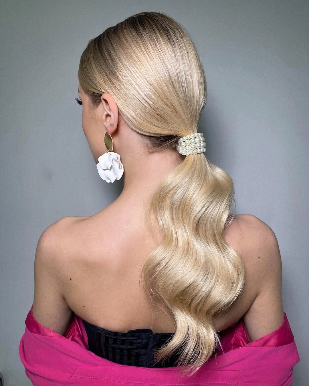 Blonde low ponytail with pearl-like band