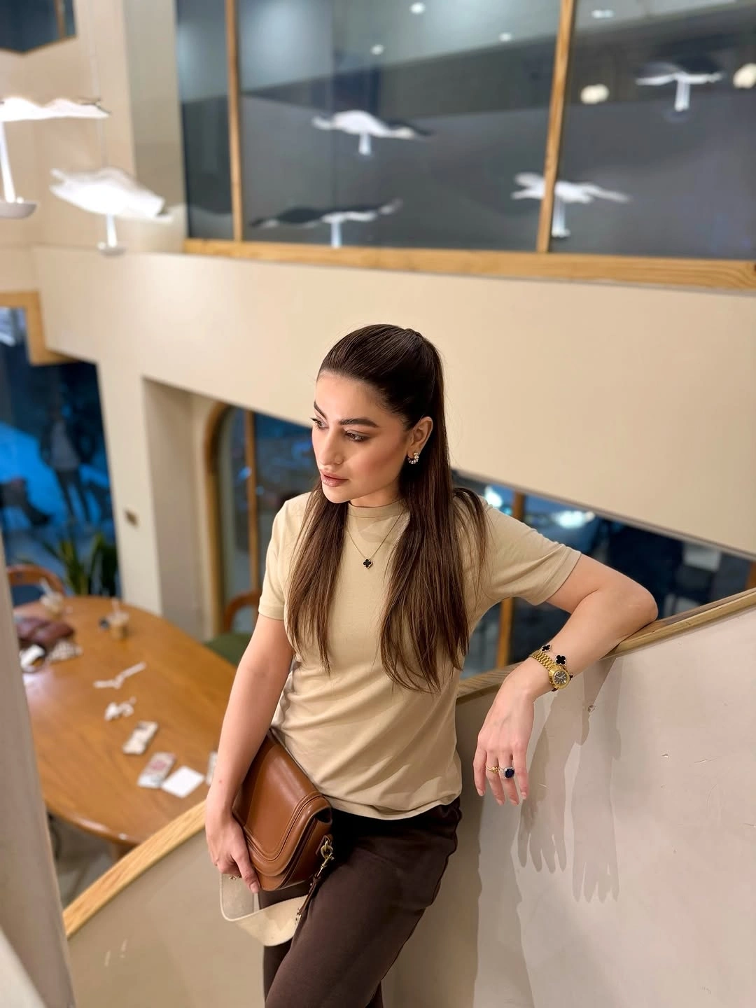 Beige top with brown trousers and crossbody bag