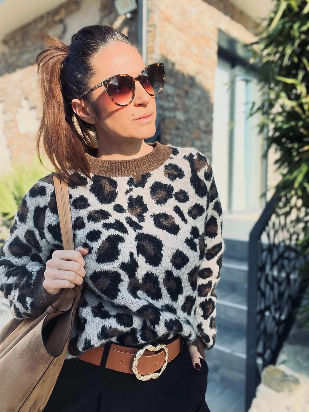 Animal print sweater with black base and brown belt