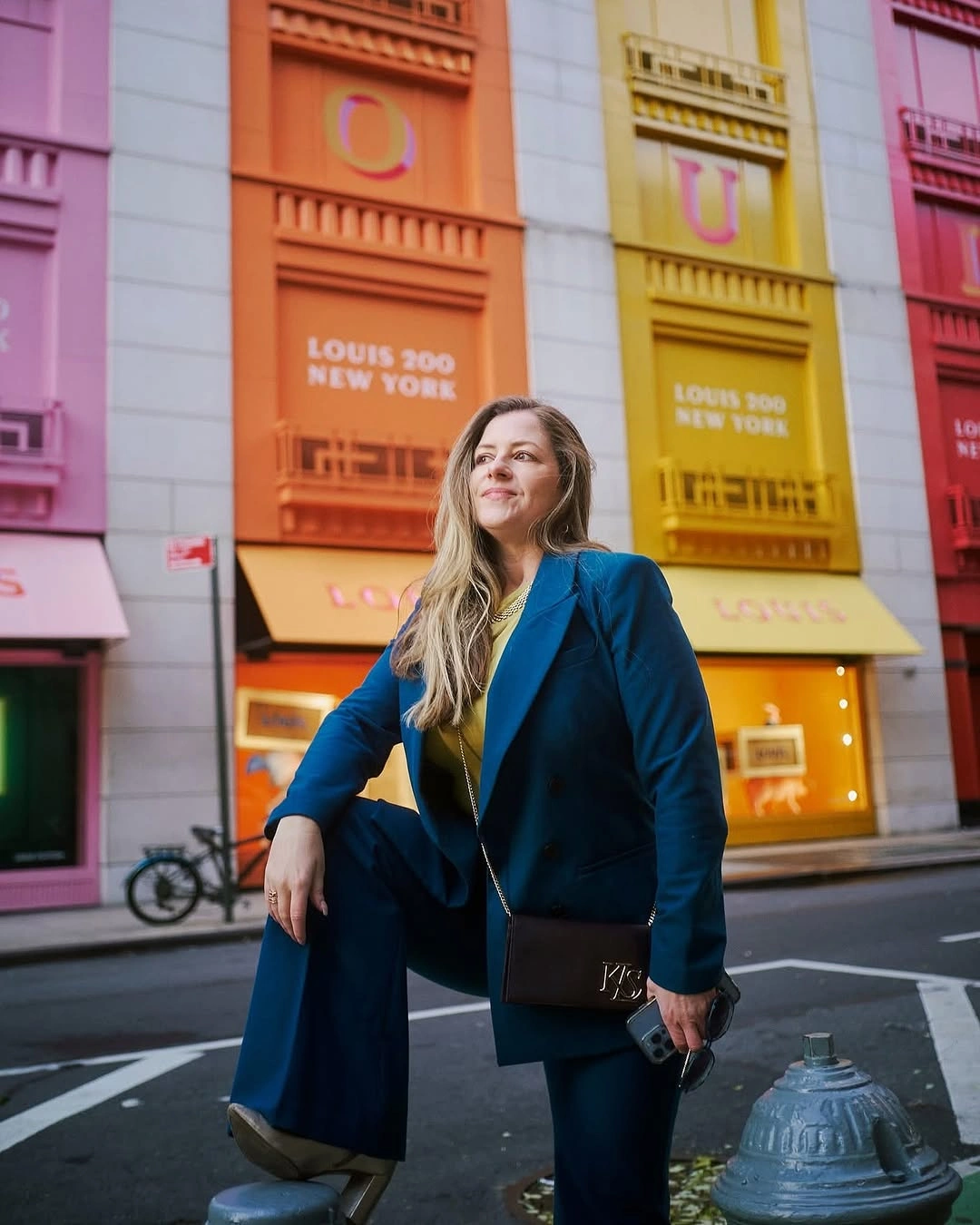Teal blazer and trousers with yellow-green top