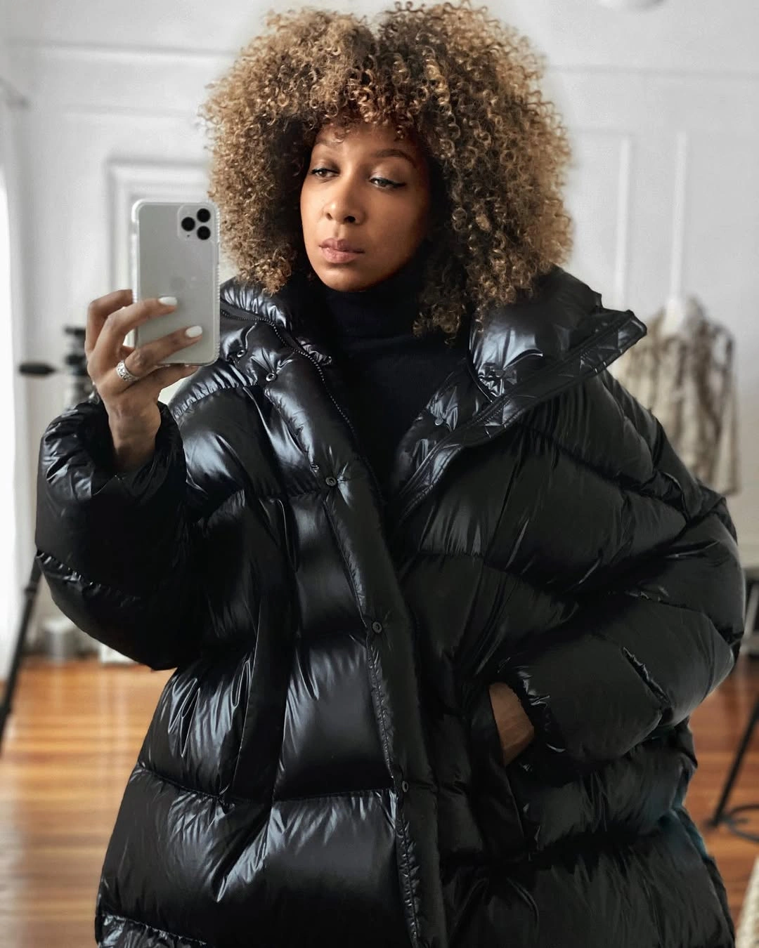High-shine black puffer with oversized collar and turtleneck