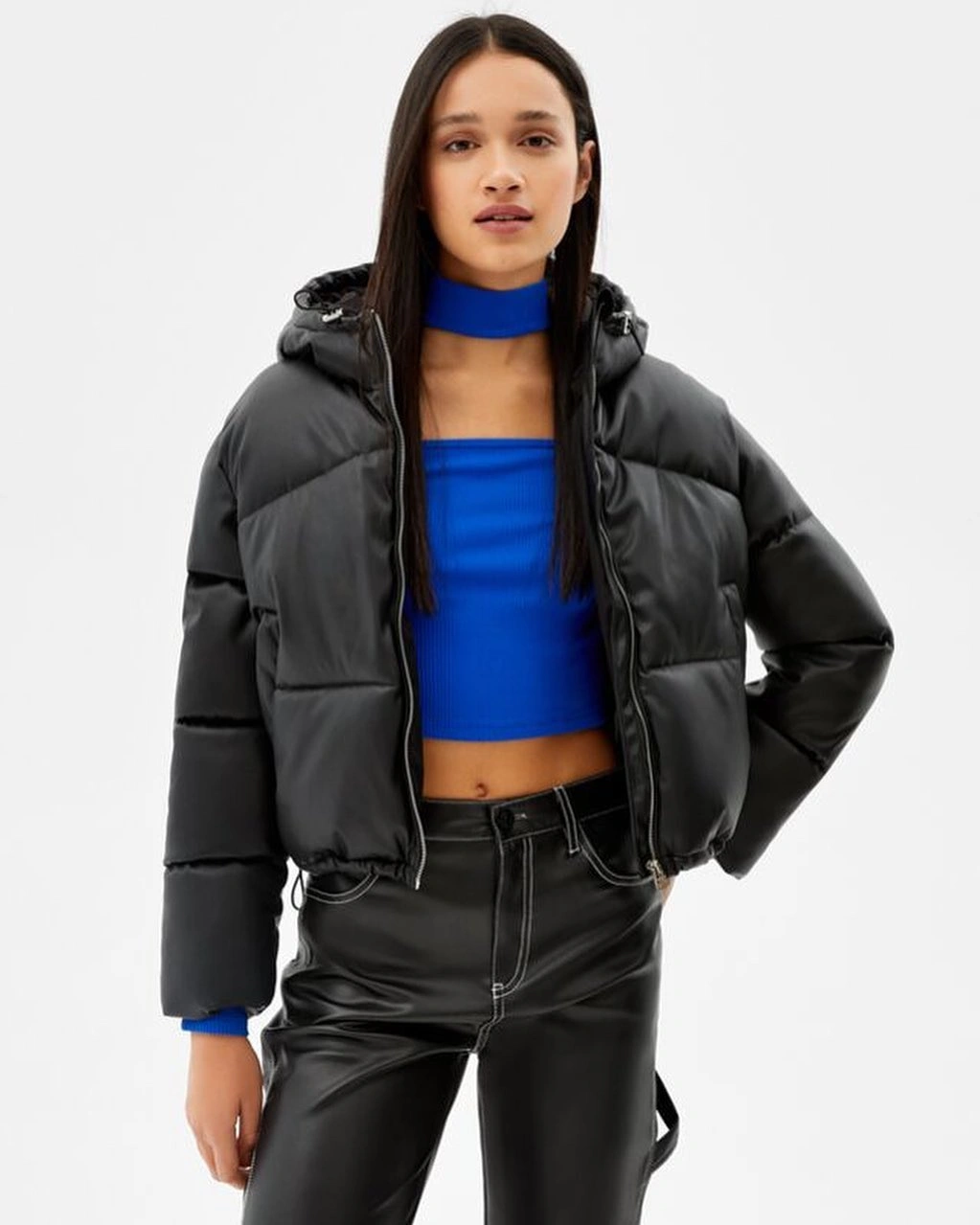 Black cropped puffer with bright blue top and neck wrap